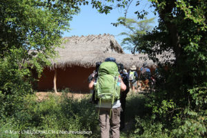Ecovolunteers arrive in a village on the edge of the Makay massif